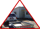 Padden builder with car & trailer laying down a stunning house